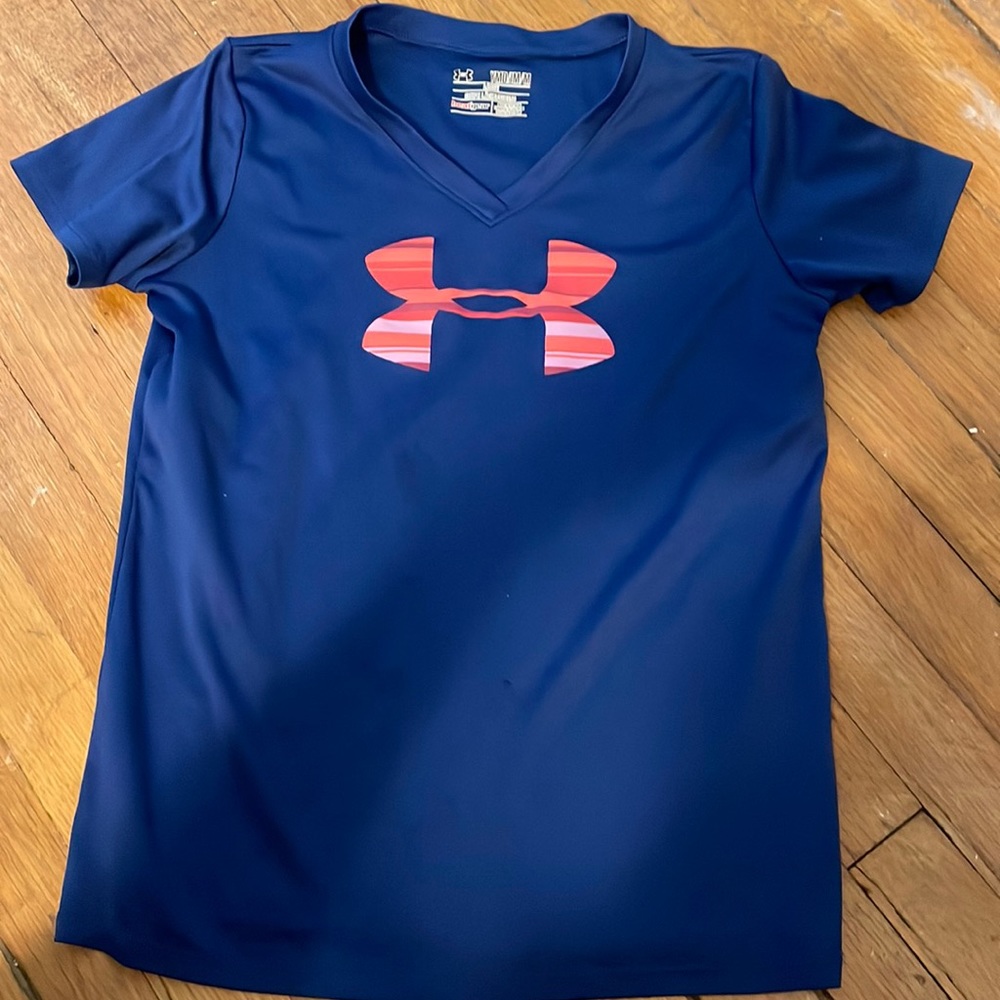2 UnderArmor t-shirts. One is navy w/ pink logo the other is gray w/ pink logo.